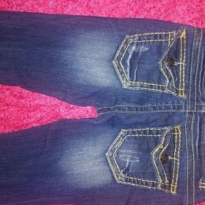 Distressed dark washed skinny jeans